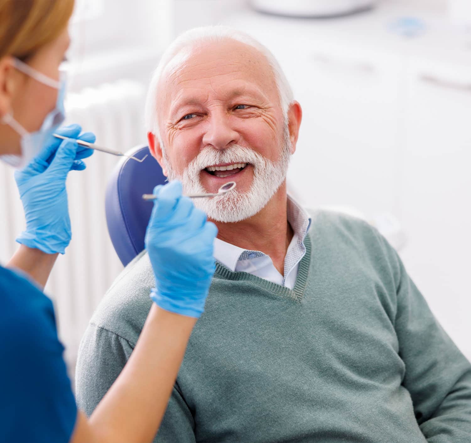 Older men smiling after implant denture
