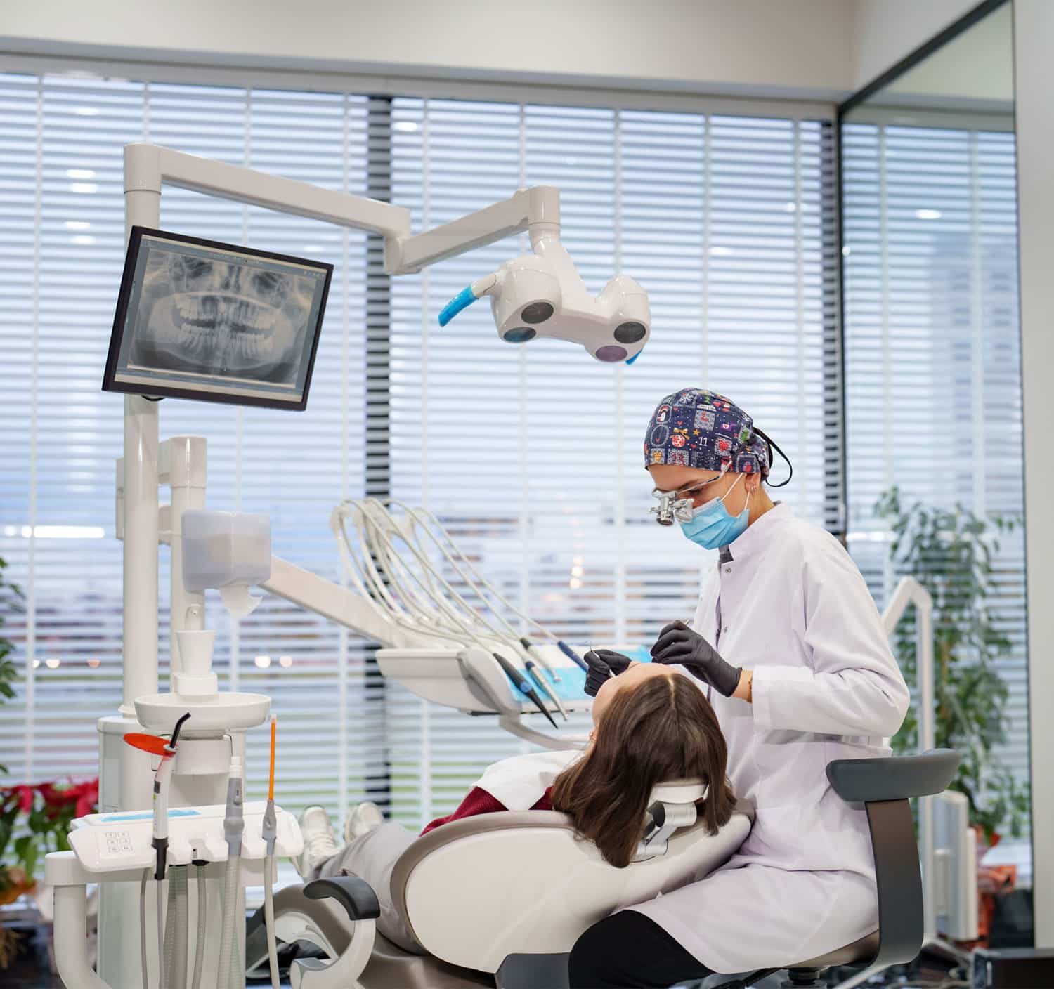 Dentist doing a procedure in a patient with the x-ray