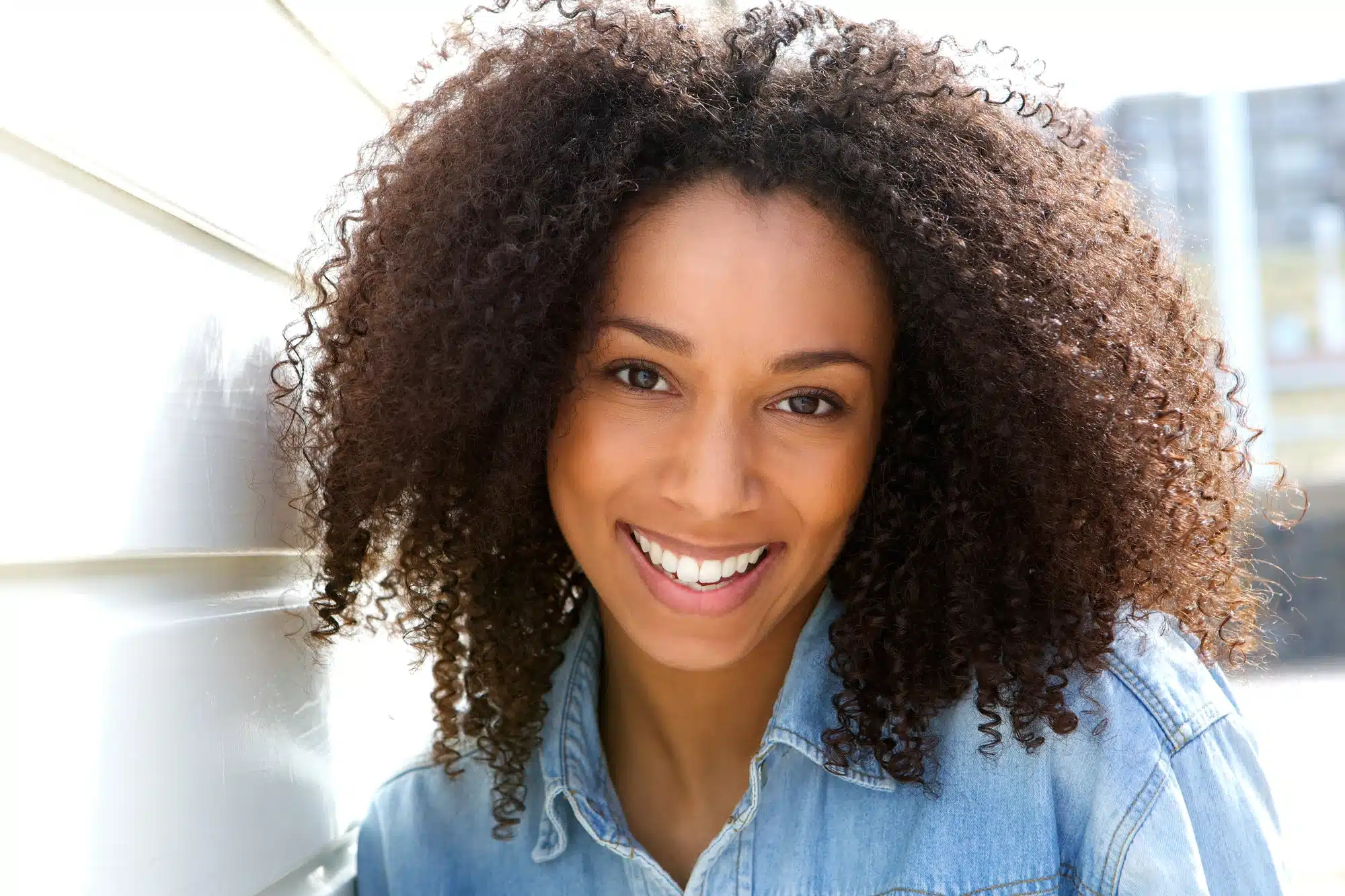 happy woman after getting dental implants in Grosse Pointe, MI