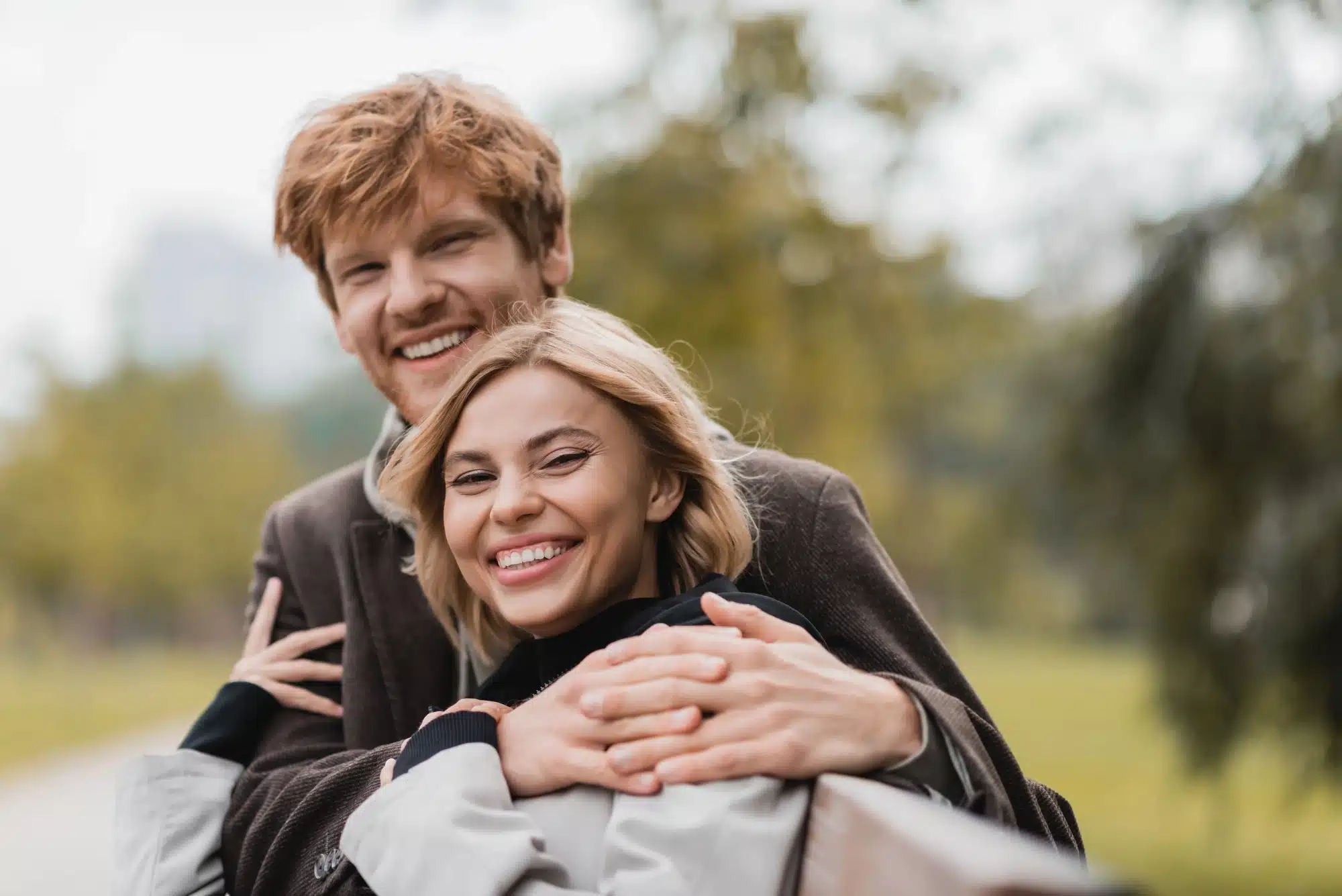 happy couple after getting a dental bridge in Grosse Pointe, MI