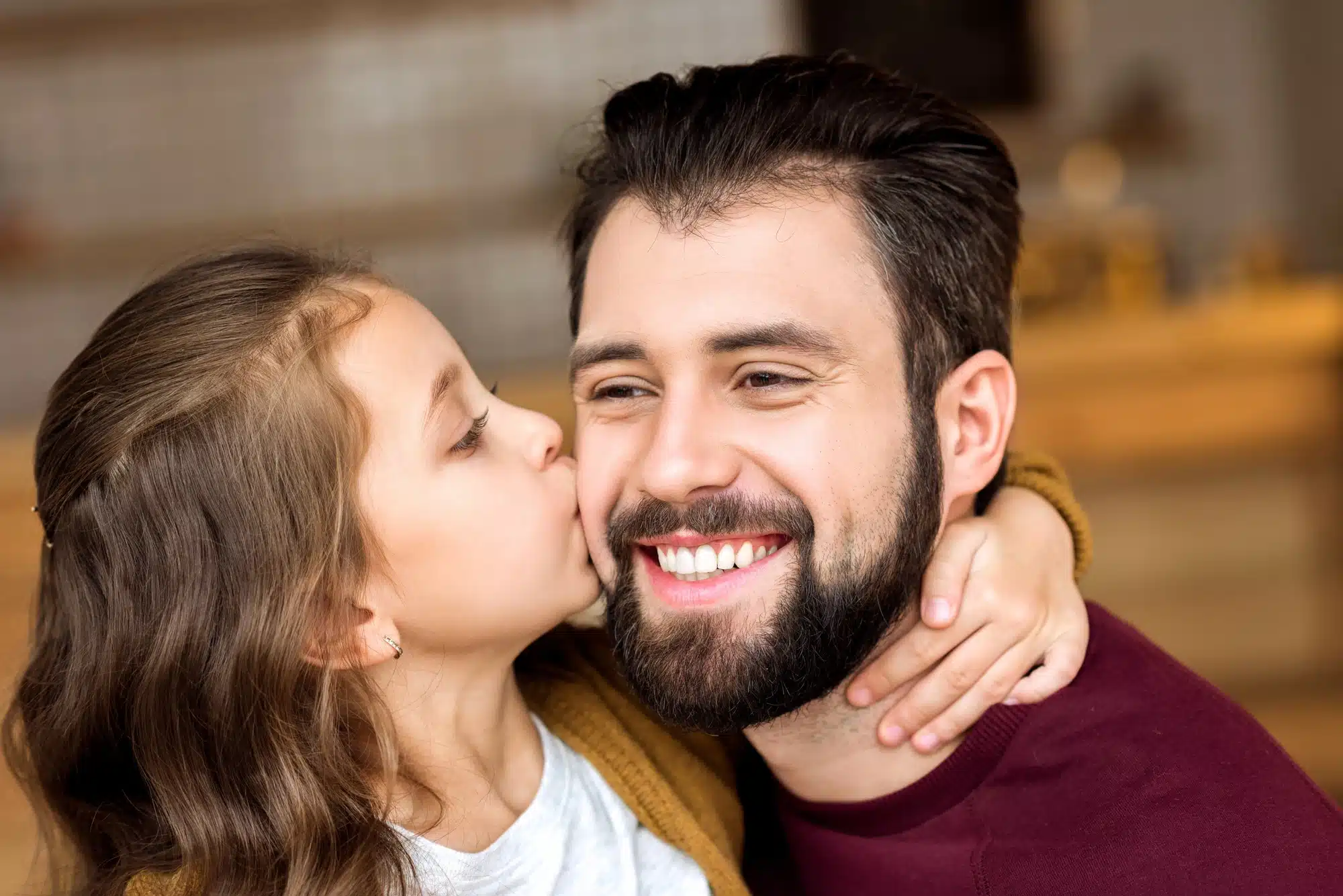 happy father after getting dental crowns in Grosse Pointe, MI